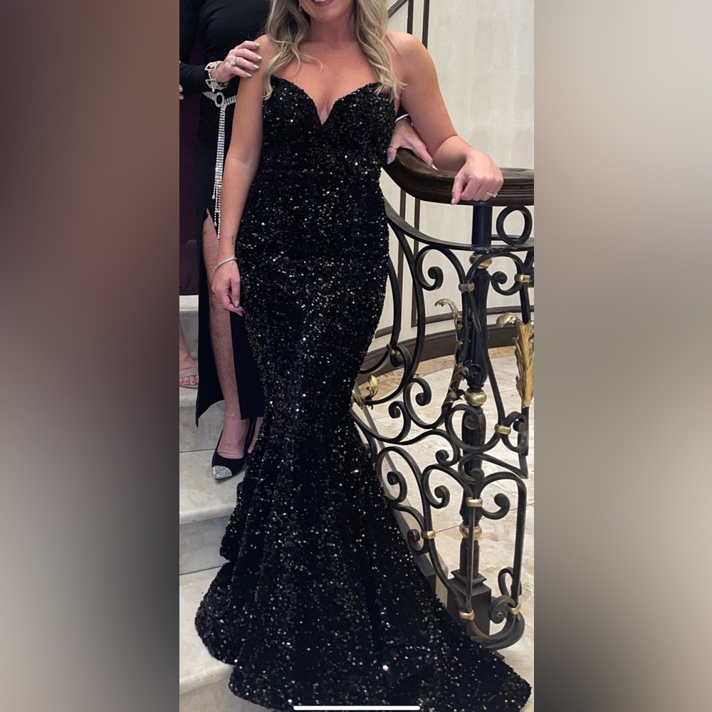 Black sequin gown with bustle train